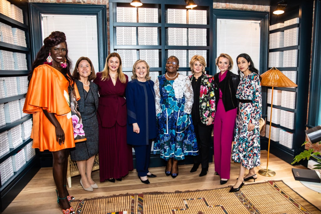 Bozoma Saint John, Maria Eugenia “Mayu” Brizuela de Avila, Amber Tamblyn, Secretary Hillary Rodham Clinton, Dr. Obiageli “Oby” Ezekwesili, Anne Finucane, Alyse Nelson, and Huma Abedin stand together in the Leadership Library