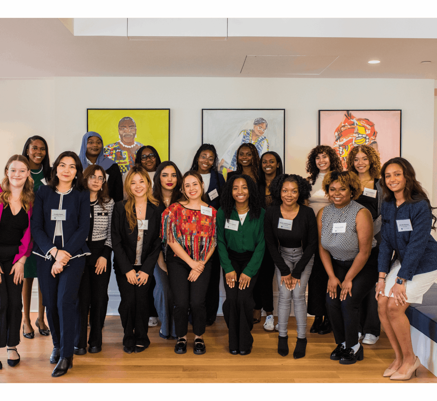 The 2025 Grassroots Voices cohort smiling at the camera from Vital Voices Headquarters.