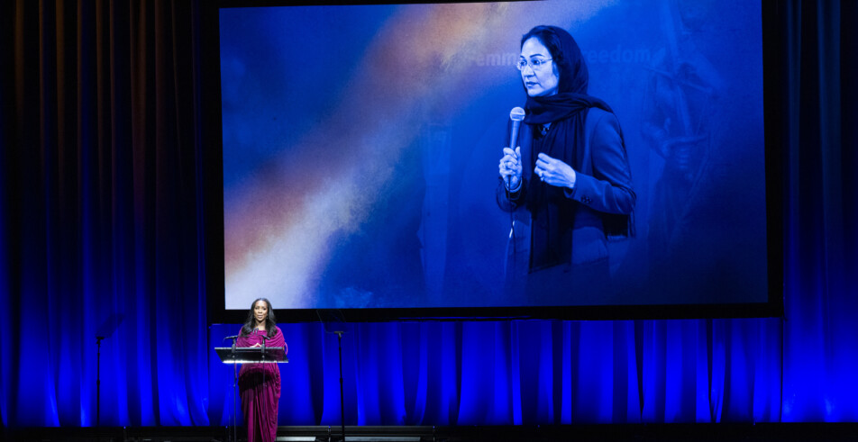 Global Leadership Award honoree Shirin Musa is presented her award for her work in advocating against marriage captivity.