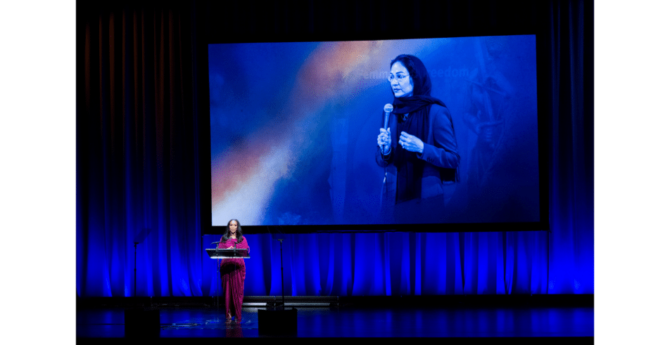 Global Leadership Award honoree Shirin Musa is presented her award for her work in advocating against marriage captivity.